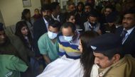 Members of hospital staff push a stretcher carrying Indian cricketer Rishabh Pant to an ambulance in Dehradun on January 4, 2023. (Photo by AFP)