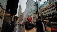 People carry shopping bags during the holiday season in New York City, US, on December 15, 2022. File Photo / Reuters
