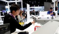 An attendee looks over a Dragonfish drone at the Auto Robotics booth during CES 2023, an annual consumer electronics trade show, in Las Vegas, Nevada, U.S. January 5, 2023. REUTERS/Steve Marcus