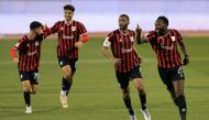 Al Rayyan's Yohan Boli (right) celebrates with teammates after scoring their second goal against Al Sailiya yesterday.