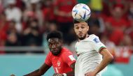 Morocco's Noussair Mazraoui in action with Canada's Alphonso Davies during the FIFA World Cup Qatar 2022 group match at the Al Thumama Stadium, December 1, 2022. (REUTERS/Carl Recine)