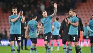 Burnley's English striker Ashley Barnes (center) and teammates show respect to the fans after the English FA Cup third round football match between Bournemouth and Burnley at the Vitality Stadium in Bournemouth, southern England on January 7, 2023. (Photo by Glyn KIRK / AFP)