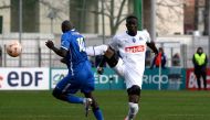 Marseille's Ivorian defender Eric Bailly (red) fouls Hyeres' midfielder Almike Moussa N'Diaye during the French Cup round of 64 football match between Olympique de Marseille (OM) and Hyeres at the Francis-Turcan Stadium in Martigues, southern France, on January 7, 2023. (Photo by Nicolas TUCAT / AFP)