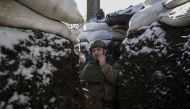 A Ukrainian serviceman stands in a trench at a frontline, amid Russia's attack on Ukraine, in Donetsk region, Ukraine January 7, 2023. Reuters/Anna Kudriavtseva