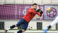 In this file photo taken on December 17, 2022 France's goalkeeper Hugo Lloris catches a ball during a training session at the Al Sadd SC training centre in Doha on the eve of the Qatar 2022 World Cup football final match between Argentina and France. (Photo by FRANCK FIFE / AFP)