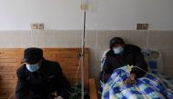 Tang Shunping, 80, receives IV drip treatment at a clinic in a village of Lezhi county after strict measures to curb the coronavirus disease (COVID-19) were removed nationwide, in Ziyang, Sichuan province, China December 29, 2022. REUTERS/Tingshu Wang