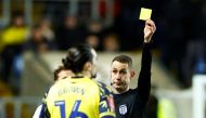 Oxford United's Ciaron Brown is shown a yellow card by referee David Coote during the FA Cup third round match v Arsenal at the Kassam Stadium, Oxford, Britain on January 9, 2023. Action Images via Reuters/John Sibley/File Photo