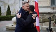 In this handout picture taken and released on January 11, 2023, Ukrainian President Volodymyr Zelensky (right) welcomes his Polish counterpart Andrzej Duda prior to the second summit of the Lublin Triangle held in the western Ukrainian city of Lviv. (Photo by HANDOUT / UKRAINIAN PRESIDENTIAL PRESS SERVICE / AFP)