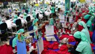 File Photo: Garment employees work in a sewing section of the Fakhruddin Textile Mills Limited in Gazipur, Bangladesh, February 7, 2021. (REUTERS/Mohammad Ponir Hossain)