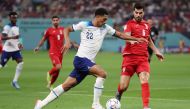 England's Jude Bellingham in action with Iran's Saeid Ezatolahi during the FIFA World Cup Qatar 2022 group match between England and Iran at Khalifa International Stadium on November 21, 2022. (REUTERS/Lee Smith)