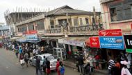 File Photo: People walk on the street around Kwame Nkrumah circle in Accra, Ghana, December 2, 2016. (REUTERS/Luc Gnago)