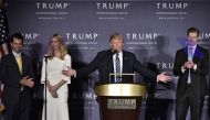 In this file photo taken on October 26, 2016, Republican presidential nominee Donald Trump, with children Donald Trump Jr., Ivanka Trump, and Eric Trump, during the grand opening of the Trump International Hotel in Washington, DC. (Photo by MANDEL NGAN / AFP)
