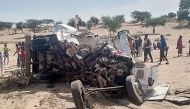 A general view of an accident scene near Sakal, northern Senegal, on January 16, 2023 where nineteen people were killed when a bus and a truck collided. (Photo by Ousseynou Diop / AFP)