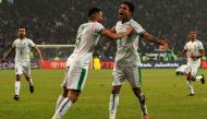 Iraq's midfielder Ibrahim Bayesh (R, #8) celebrates after scoring his team's first goal during the Arabian Gulf Cup semi-final football match between Iraq and Qatar at the Basra International Stadium in Iraq's southern city on January 16, 2023. (Photo by AHMAD AL-RUBAYE / AFP