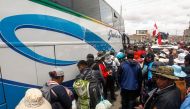 Demonstrators prepare to depart to Lima to protest against the government of Peruvian President Dina Boluarte in the city of Ilave, Puno, southern Peru on January 17, 2023.  (Photo by Juan Carlos CISNEROS / AFP)