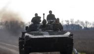 Ukrainian servicemen ride an armoured fighting vehicle, amid Russia's attack on Ukraine, in a frontline in Mykolaiv region, Ukraine, November 4, 2022. (REUTERS/Valentyn Ogirenko)
