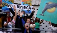 Environmental activists shout slogans before Chile's committee of ministers denied permits for Andes Iron's Dominga copper and iron mining project, in Santiago, Chile, January 18, 2023. (REUTERS/Ivan Alvarado)