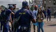 Congolese police talk to demonstrators calling on authorities to enforce an agreed withdrawal of M23 rebels from occupied territory in the region, within Goma in the North Kivu province of the Democratic Republic of Congo on January 18, 2023. REUTERS/Djaffar Sabiti
