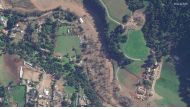 This handout satellite image courtesy of Maxar Technologies shows San Antonio Creek flooding homes and ranches in Oak View, California, on January 16, 2023.(Photo by Satellite image ｩ2022 Maxar Technologies / AFP) 