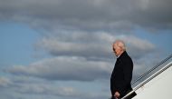 US President Joe Biden steps off Air Force One at Moffett Federal Airfield, NASA Ames Research Center Boundary, in Mountain View, California, on January 19, 2023. (Photo by ANDREW CABALLERO-REYNOLDS / AFP)