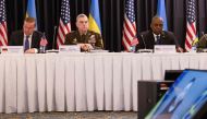 (From left) German Defence Minister Boris Pistorius, US General Mark Milley, and US Secretary of Defence Lloyd Austin listen to a video message from Ukrainian President Volodymyr Zelensky during the Ukraine Defense Contact Group meeting at Ramstein Air Base in Ramstein-Miesenbach, southwestern Germany on January 20, 2023. (Photo by Andre Pain / AFP)