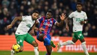 Newcastle United's Callum Wilson (left) fights for the ball with Crystal Palace's Cheick Doucoure during the English Premier League match between Crystal Palace and Newcastle United at Selhurst Park in south London on January 21, 2023. (Photo by Ben Stansall / AFP)
