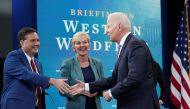 US President Joe Biden shakes hands White House Chief of Staff Ron Klain as Energy Secretary Jennifer Granholm looks on as he arrives for a meeting with cabinet officials, governors, and private sector partners to discuss preparedness of Western states to heat, drought and wildfires this season, at the White House in Washington, US on June 30, 2021. File Photo / Reuters