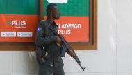 A Somali policeman stands holds his position near the mayor's office following a blast in Mogadishu, Somalia January 22, 2023. REUTERS/Feisal Omar