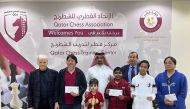 Top performers of Qatar Center Ranking Chess Championship pose for a group photo. 