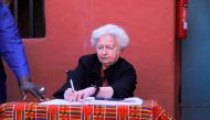 US Treasury Secretary Janet Yellen signs the visitor book after she visited the House of Slaves (Maison des Esclaves) at Goree Island off the coast of Dakar, Senegal on January 21, 2023. REUTERS/Ngouda Dione/File Photo