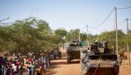 In this file photo taken on November 14, 2019, soldiers of the French Army patrols the village Gorom Gorom in Armoured Personnel Carriers during the Barkhane operation in northern Burkina Faso. (Photo by MICHELE CATTANI / AFP)