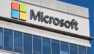 In this file photo taken on January 18, 2023 a sign outside a building with offices belonging to Microsoft is seen in Chevy Chase, Maryland. - Microsoft on January 23, 2023 said it had extended its partnership with OpenAI, the research lab and creator of ChatGPT, an artificial intelligence chatbot that has sparked widespread fears of cheating in schools and universities. (Photo by SAUL LOEB / AFP)
 