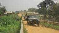 In this file photo taken on March 19, 2022, a convoy of FARDC (Armed Forces of the Democratic Republic of Congo) soldiers on the Loya bridge on the Beni-Komanda axis considered as the axis of death in the chiefdom of Walese Vonkutu. (Photo by Sébastien Kitsa Musayi / AFP)