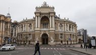 A man walks next to the Opera Theatre building in the city centre, amid Russia's attack on Ukraine, in Odesa, Ukraine, January 25, 2023. (REUTERS/Serhii Smolientsev)