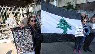 Families of the victims of the 2020 port blast take part in a protest against Lebanon's top public prosecutor who charged the judge investigating the blast and ordered the release of those detained in connection with the explosion in front of the Justice Palace in Beirut, Lebanon January 26, 2023. REUTERS/Aziz Taher
