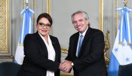 This handout picture released by the Argentinian Presidency shows Argentine President Alberto Fernandez (right) shaking hands with Honduran President Xiomara Castro at the San Martin palace in Buenos Aires on January 25, 2023. (Photo by Maria Eugenia CERUTTI / Argentinian Presidency / AFP) 