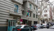 Police stay guard in front of the Azerbaijan embassy in Tehran on January 27, 2023, following an attack. Photo by AFP