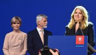 Presidential candidate Petr Pavel, former Chief of the General Staff of the Czech Army, and his wife Eva (left) listen to a speech by Slovakian President Zuzana Caputova during a press conference in Prague, Czech Republic on January 28, 2023, after Pavel became the fourth president of the Czech Republic according to official results.  (Photo by Michal Cizek / AFP)
