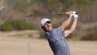 Rory Mcllroy of Northern Ireland plays a shot during the final of the Dubai Desert Classic 2023 Golf Championship at the Emirates Golf Club in Dubai, on January 30, 2023. (Photo by Karim Sahib / AFP)