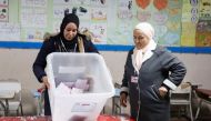 Members of the election committee empty a ballot box to count votes at a polling station during the second round of the parliamentary election in Tunis, Tunisia on January 29, 2023. REUTERS/Zoubeir Souissi
