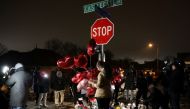 People attend a vigil at the intersection of Castlegate Lane and Bear Creek Cove, where Nichols was beaten by Memphis Police officers, in Memphis, Tennessee, U.S. January 30, 2023. REUTERS/Alyssa Pointer

