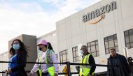 Workers stand in line to cast ballots for a union election at Amazon's JFK8 distribution center, in the Staten Island borough of New York City, US, on March 25, 2022. File Photo / Reuters
 