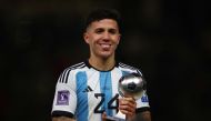 December 18, 2022 Argentina's Enzo Fernandez poses with his Best Young Player award during the award ceremony after the match REUTERS/Kai Pfaffenbach/File Photo