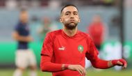 In this file photo taken on December 17, 2022 Morocco's midfielder Hakim Ziyech warms up prior to the Qatar 2022 World Cup third place play-off football match between Croatia and Morocco at Khalifa International Stadium in Doha. - The arrival of renowned Moroccan striker Hakim Ziyech at Paris SG was not approved in time for the end of the winter transfer window. (Photo by KARIM JAAFAR / AFP)