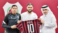 Al Rayyan SC President Sheikh Ali bin Saud Al Thani, coach Nicolas Cordova and  Sofiane Boufal hold a team jersey during the unveiling ceremony, yesterday.