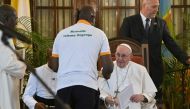 Pope Francis (2nd R) meets with representatives of charities at the Apostolic Nunciature in Kinshasa, Democratic Republic of Congo (DRC), on February 1, 2023. (Photo by Tiziana FABI / AFP)