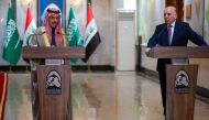 Iraq's Foreign Minister Fuad Hussein (R) listens as his Saudi counterpart Faisal bin Farhan speaks during a joint press conference in Baghdad on February 2, 2023. (Photo by Ahmad AL-RUBAYE / AFP)