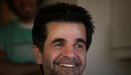 Iranian film director Jafar Panahi smiles, following his release on bail, at his home in Tehran on May 25, 2010. File photo / Reuters
