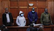 Former police officers and primary suspects in the murder of rights lawyer Willie Kimani and two others in 2016, Sergeant Fredlick ole Leliman (R) and his fellow officers Stephen Cheburet (2R), Sylvia Wanjiku (2L) along with a police informant, Peter Ngugi (L) stand in the dock during their sentencing in the Kenyan capital, Nairobi on February 3, 2023. (Photo by Tony KARUMBA / AFP)