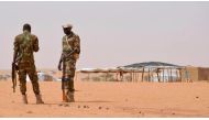 Niger soldiers stand guard on October 21, 2016 at the Tazalit United Nations refugee camp in the Tahoua region, some 300 kilometres northeast of the capital Niamey, where militants had killed 22 soldiers on October 7, 2016. Boureima Hama, AFP
